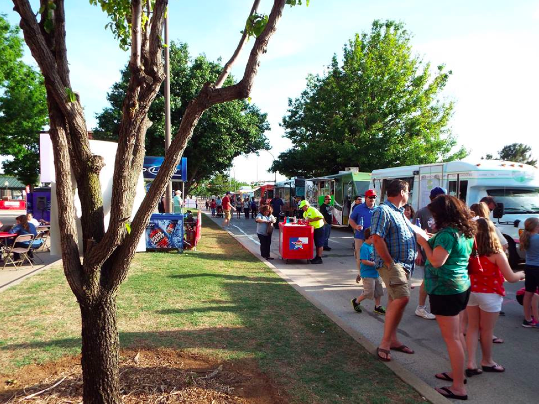 Fans explore the Texas Food Truckin' Fest in Arlington, TX.