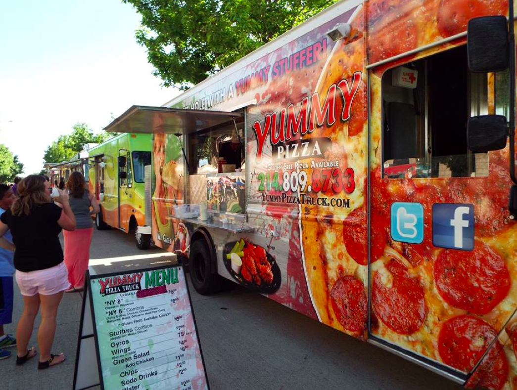 Fans wait outside of Yummy Pizza Truck at the Texas Food Truckin' Fest in Arlington, TX.