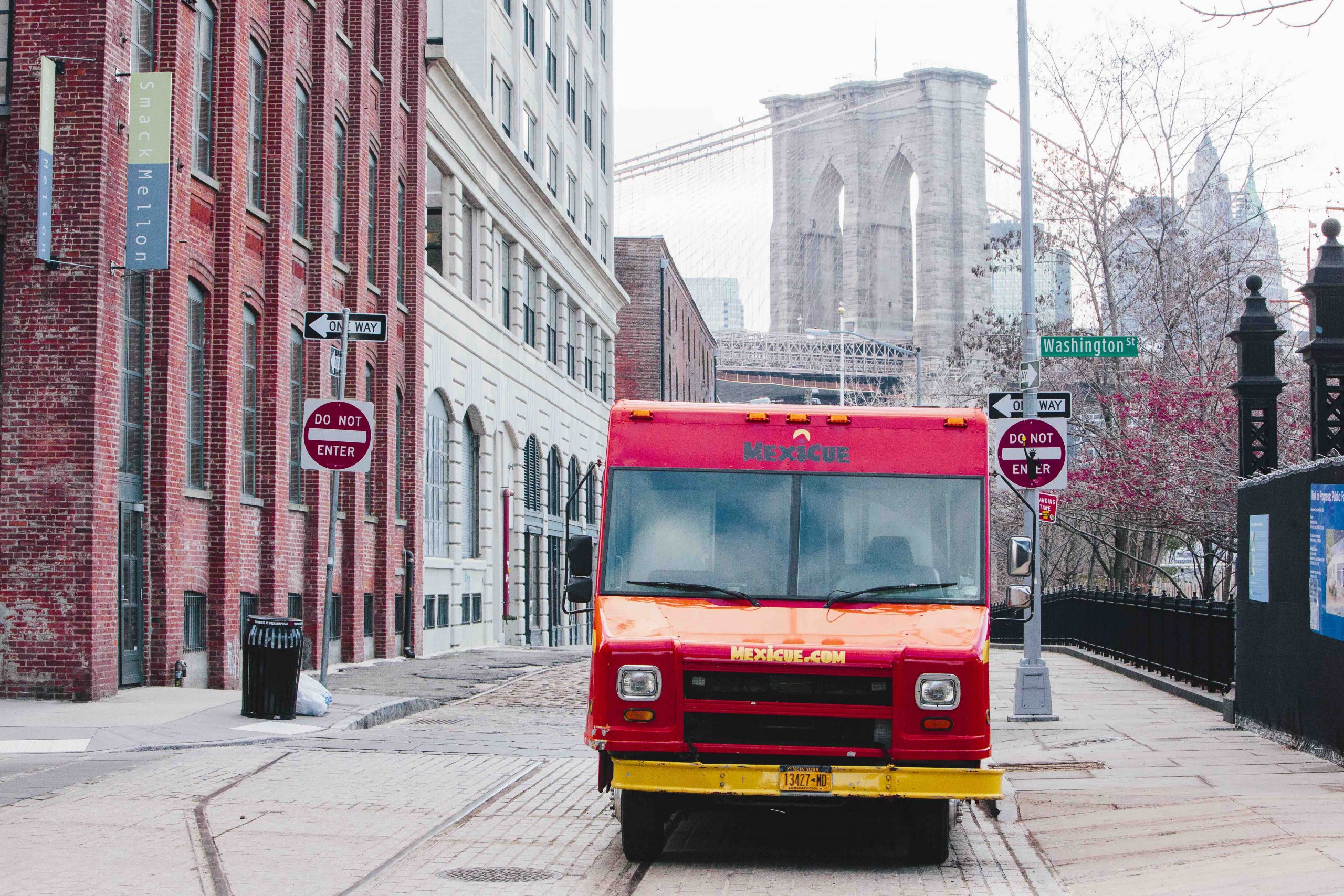 Red food truck parked on Brooklyn street