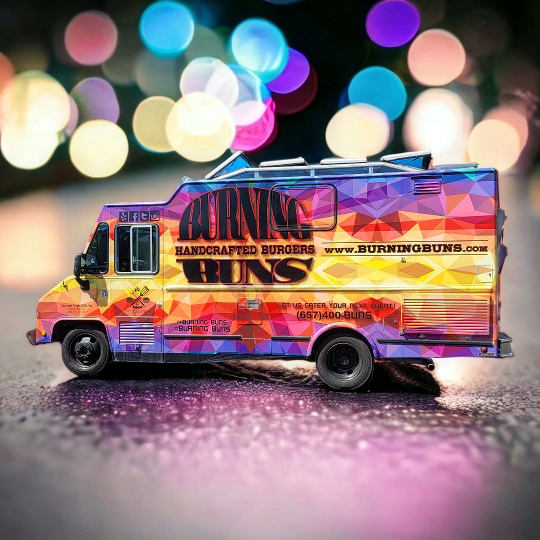 Multicolored miniature food truck in purple, yellow, and pink