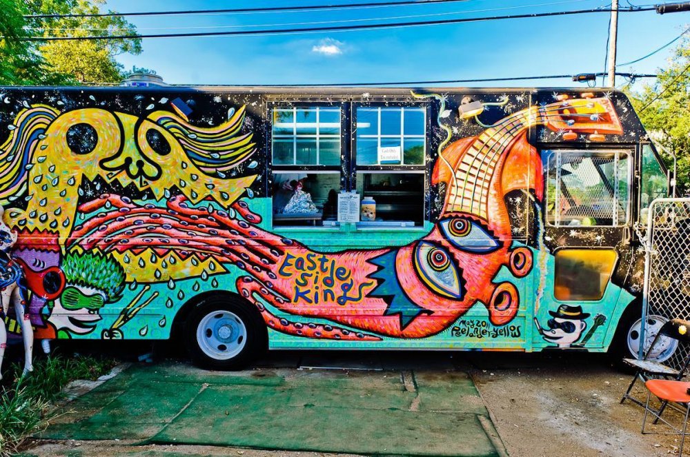 Colorful food truck on green grass